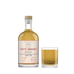 Nina's Sømmers cocktail in a clear bottle with a white label, accompanied by a glass filled with the drink.-Cocktails by Nina